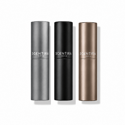 Three refillable atomisers, one of each colour
